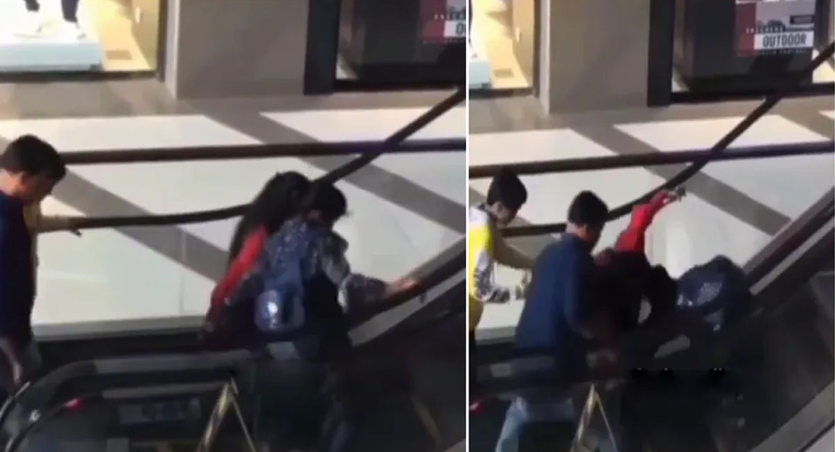 video of two girls climbing escalator video viral