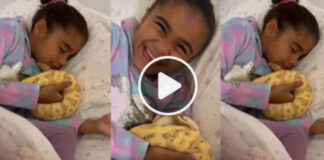 girl hugs snake and sleeps in bed video viral