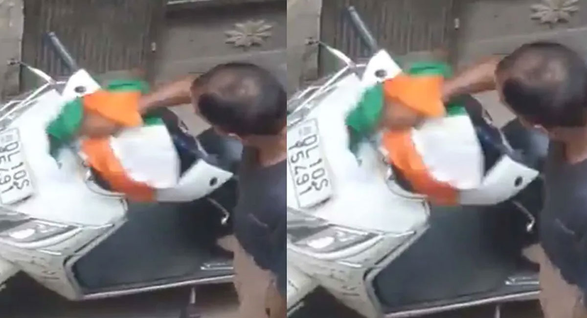 man cleans scooty with national flag video viral